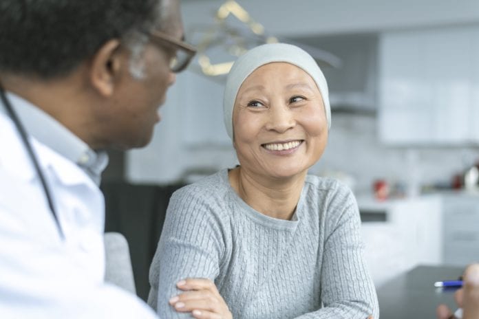 cancer patient speaks with physician