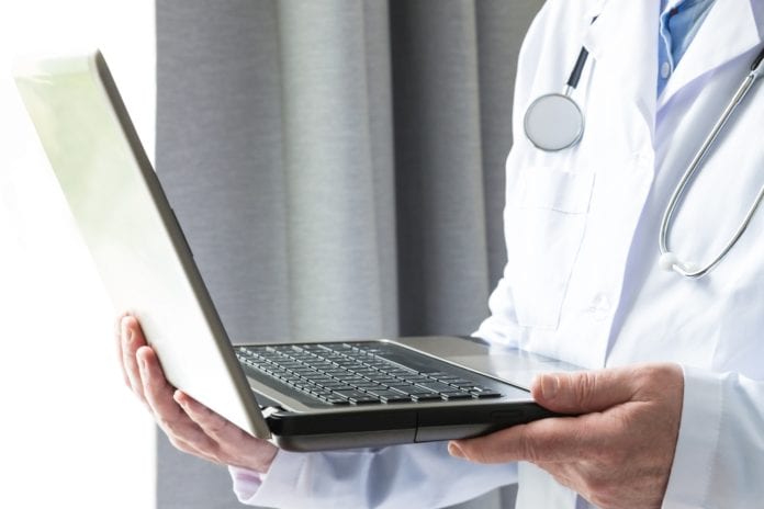 doctor on laptop for telehealth appointment