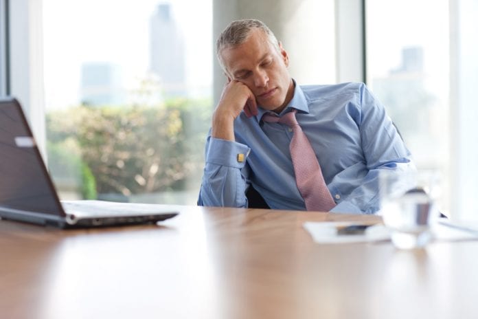businessman sleep at office desk
