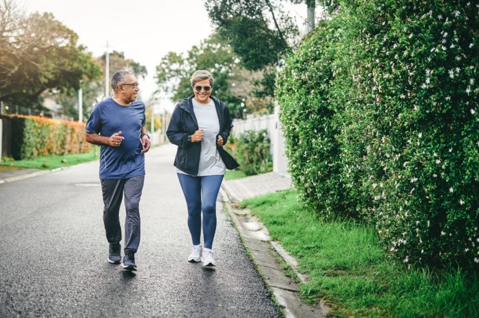 senior couple outdoors jogging