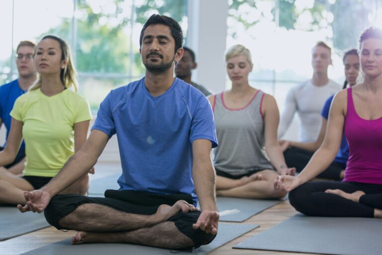 group of people in yoga class